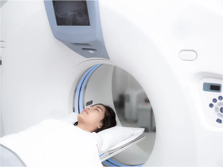 A woman receiving a CT scan