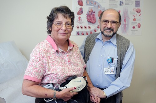 Susan Neikens holds the controls of her left ventricular assist device (LVAD) du