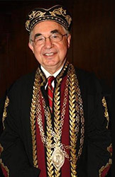 Dr. Rigas accepting an honorary PhD from the University of Patras in 2013