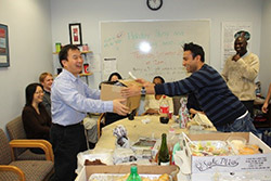 Photograph of exchanging gifts within the lab